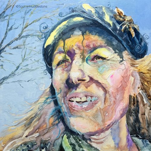 Self Portrait called 'Forgetful' by Sophie Huddlestone 2019. Walking to fetch my daughter from school I had forgotten my blue tinted Irlen Syndrome glasses and was squinting with the brightness of the sun. Painted onto a canvas board and 3D watercolour texture paste was added. Portrait painted in watercolours, the hat and background are in oil paints. I really went wild with this one to see how exaggerated  I could go, mixing complementary colours yellow and blue bringing the main focus on the squinting eyes and the uncomfortable feeling to this portrait.